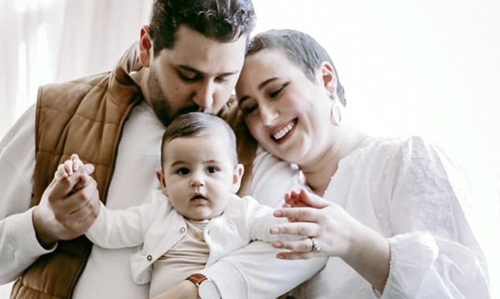 Ashli Brown with her husband and daughter.