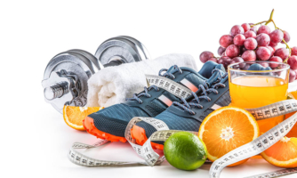 Weights, towel, grapes, tennis shoes, measuring tape, juice, and sliced oranges.