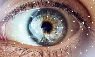 Closeup of a human eye, with geometric shapes mapping random patterns