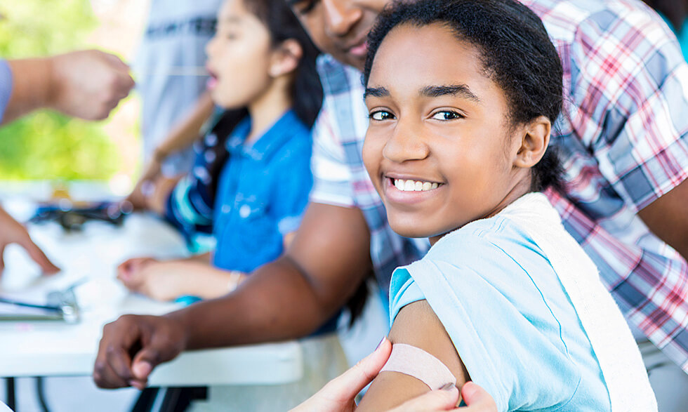 Kids smiling after flu vaccine shot