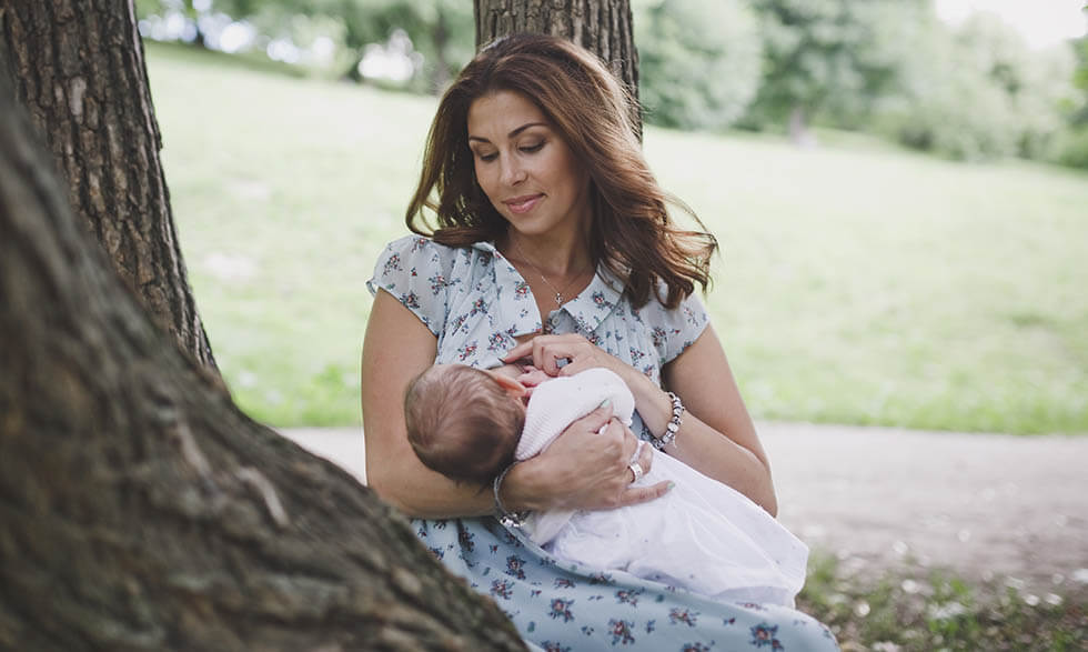 Woman breastfeeding baby.