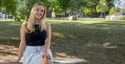 Brianna Parker sitting on park bench.