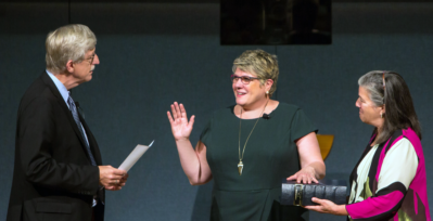 National Institutes of Health Director Francis S. Collins, M.D., Ph.D., swears in Patricia Flatley Brennan, R.N., Ph.D., as the 19th director of NLM.