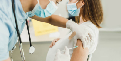 Pregnant woman getting vaccine shot