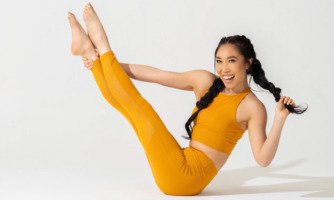 Casey Ho demonstrating a yoga position.